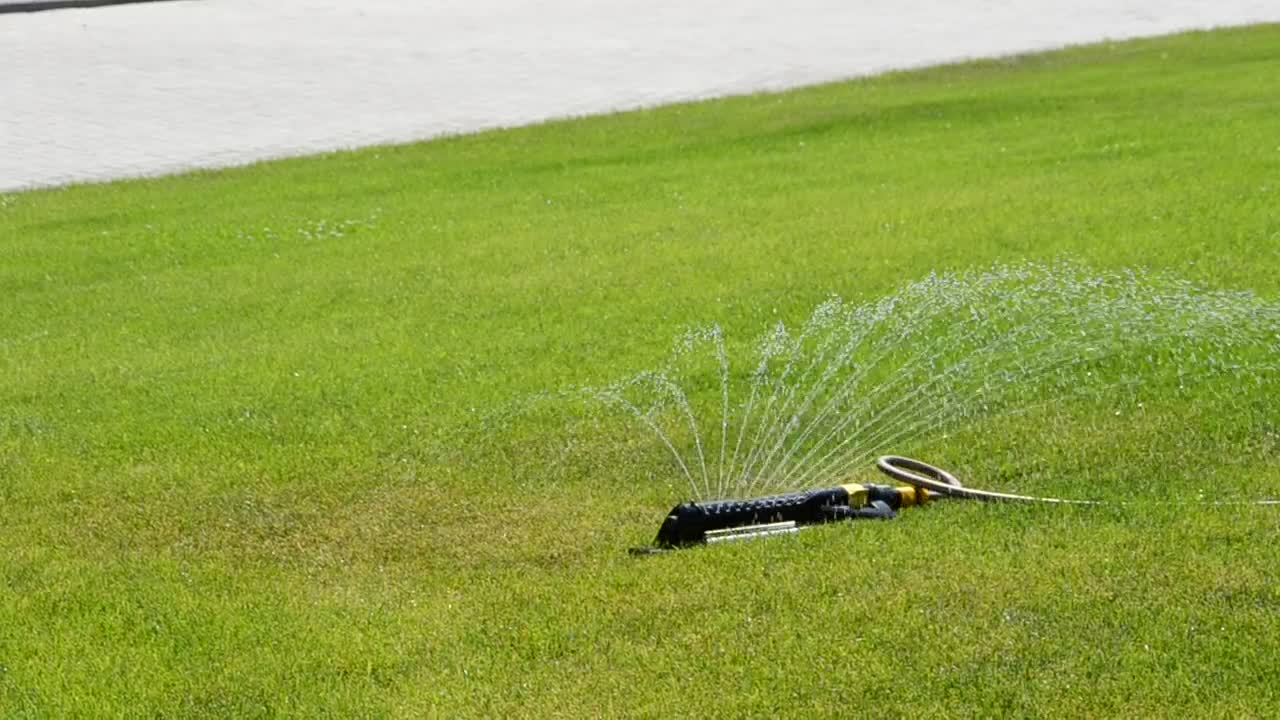 Stock Footage Water Sprinkler In A Public Park Live Wallpaper - Free Download