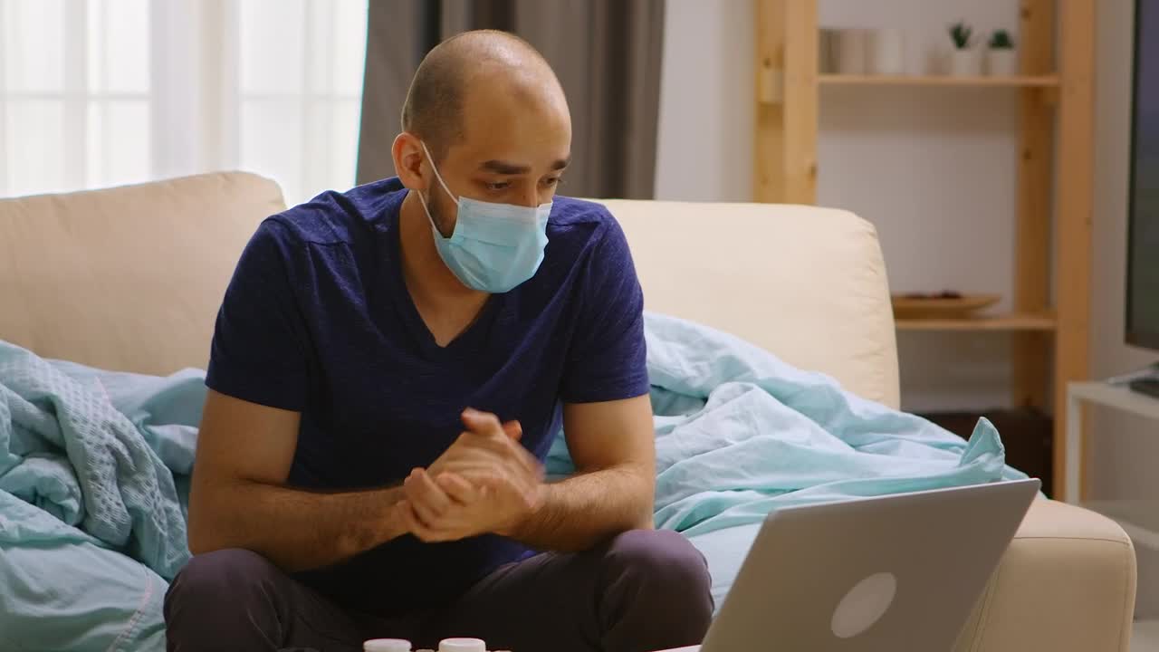 Free Stock Video Sick Man Chats On Video Call From Couch At Home Live Wallpaper - Free Download
