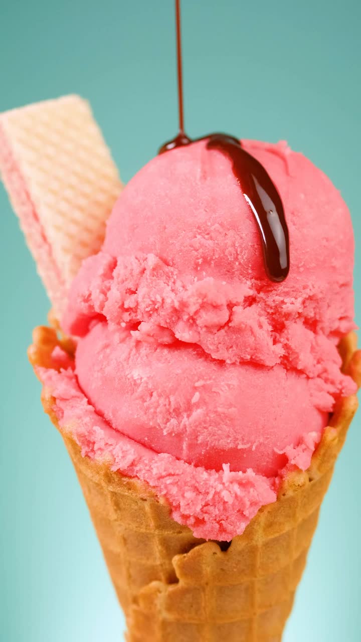 Free Video Stock Strawberry Ice Cream Cone With Chocolate Syrup On A Blue Live Wallpaper - Free Download