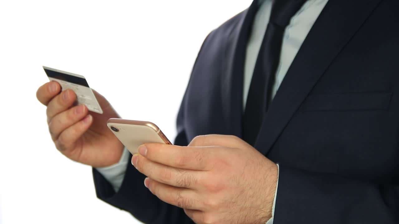 Stock Video Man Entering Bank Data In A Cellphone Animated Wallpaper - Free Download