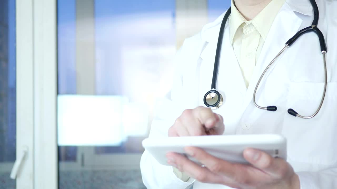 Stock Video Doctor Working On A Tablet Device Live Wallpaper For PC - Free Download