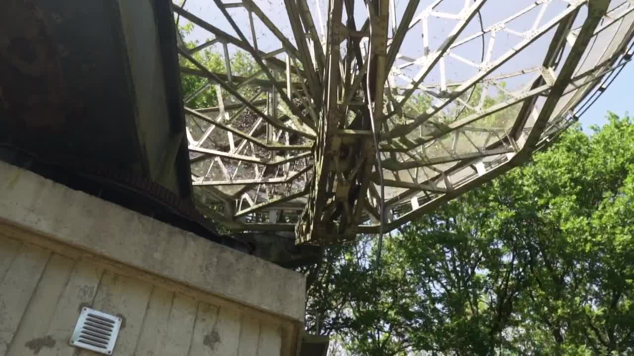 Stock Video Old Satellite Dish Seen From Below Surrounded By Trees Live Wallpaper - Free Download