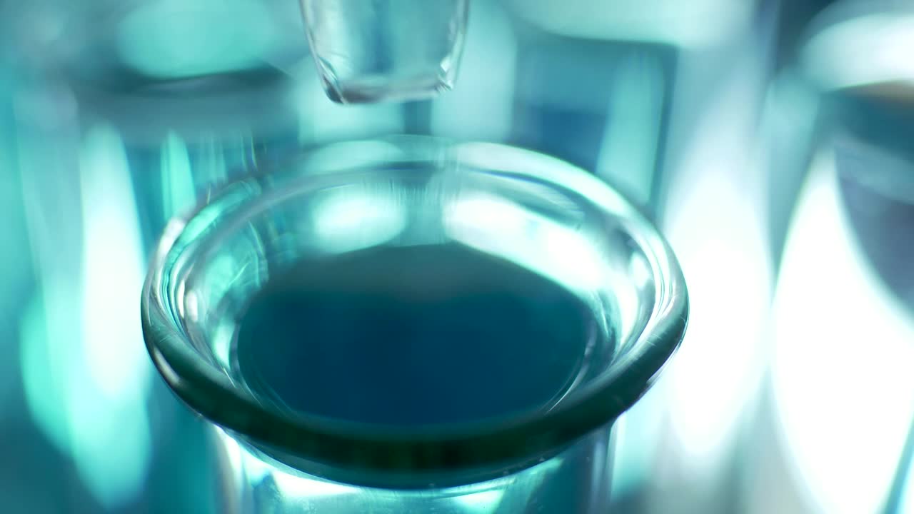 Stock Video Dropping Liquid Into A Lab Tube Close Up Live Wallpaper For PC - Free Download
