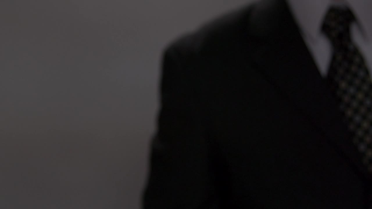 Stock Video Man Displaying His Business Card Animated Wallpaper - Free Download