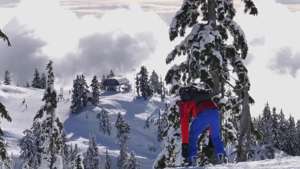 Free Video Stock Skier Fitting A Boot On Top Of A Mountain Live Wallpaper - Free Download