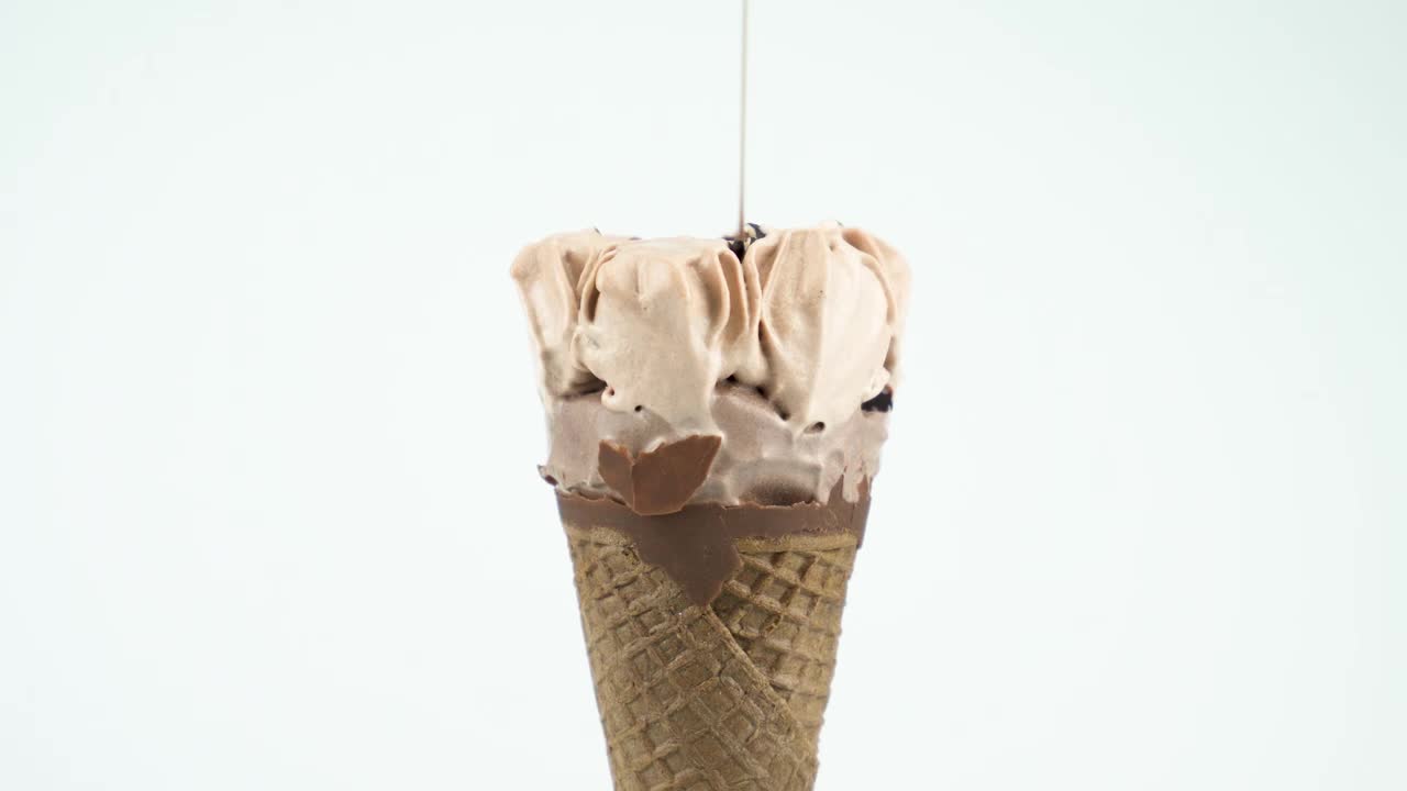 Stock Video Icecream Cone With Syrup On A Light Background Animated Wallpaper - Free Download