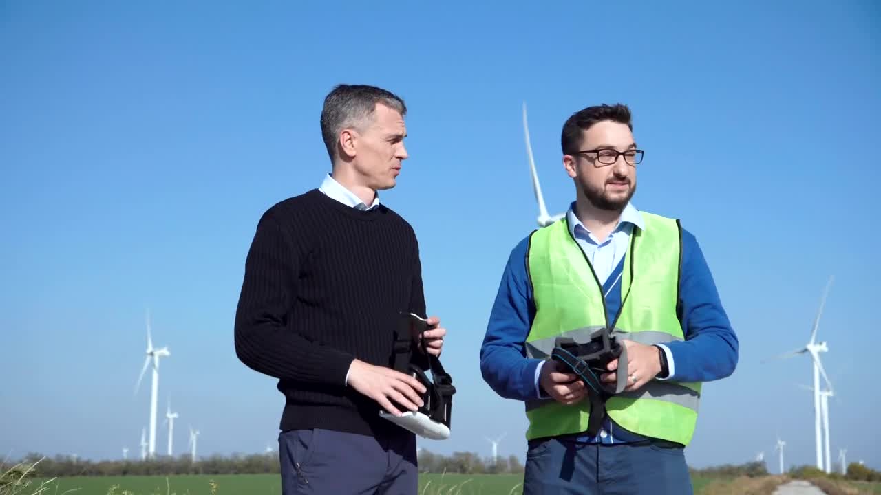 Stock Video Engineers Using Vr Headsets On Wind Farm Live Wallpaper For PC - Free Download