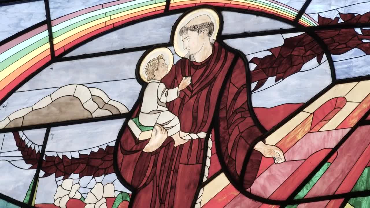 Stock Video Monk Carrying A Child Depicted In The Stained Glass Windo Animated Wallpaper - Free Download
