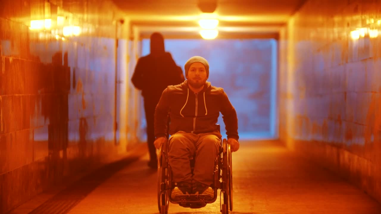 Stock Video Disabled Man In A Wheelchair Riding In The Underpass Live Wallpaper For PC - Free Download