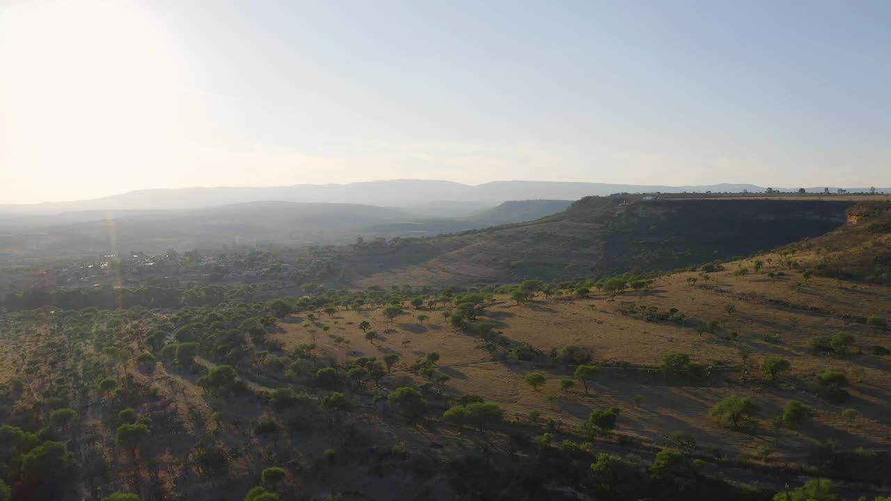 Stock Video Flying Over Mountain Ranges In The Warm Savanna Live Wallpaper For PC - Free Download