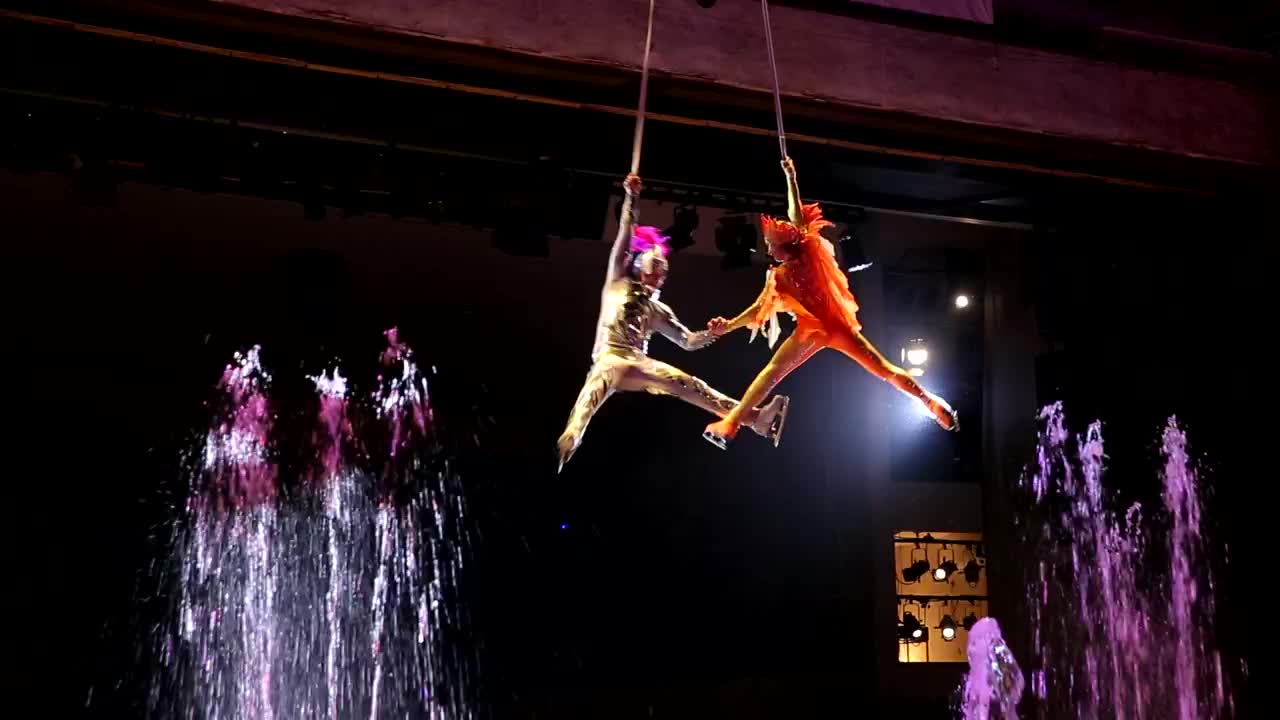 Stock Video Performer Spinning Above Bright Fountains Live Wallpaper - Free Download