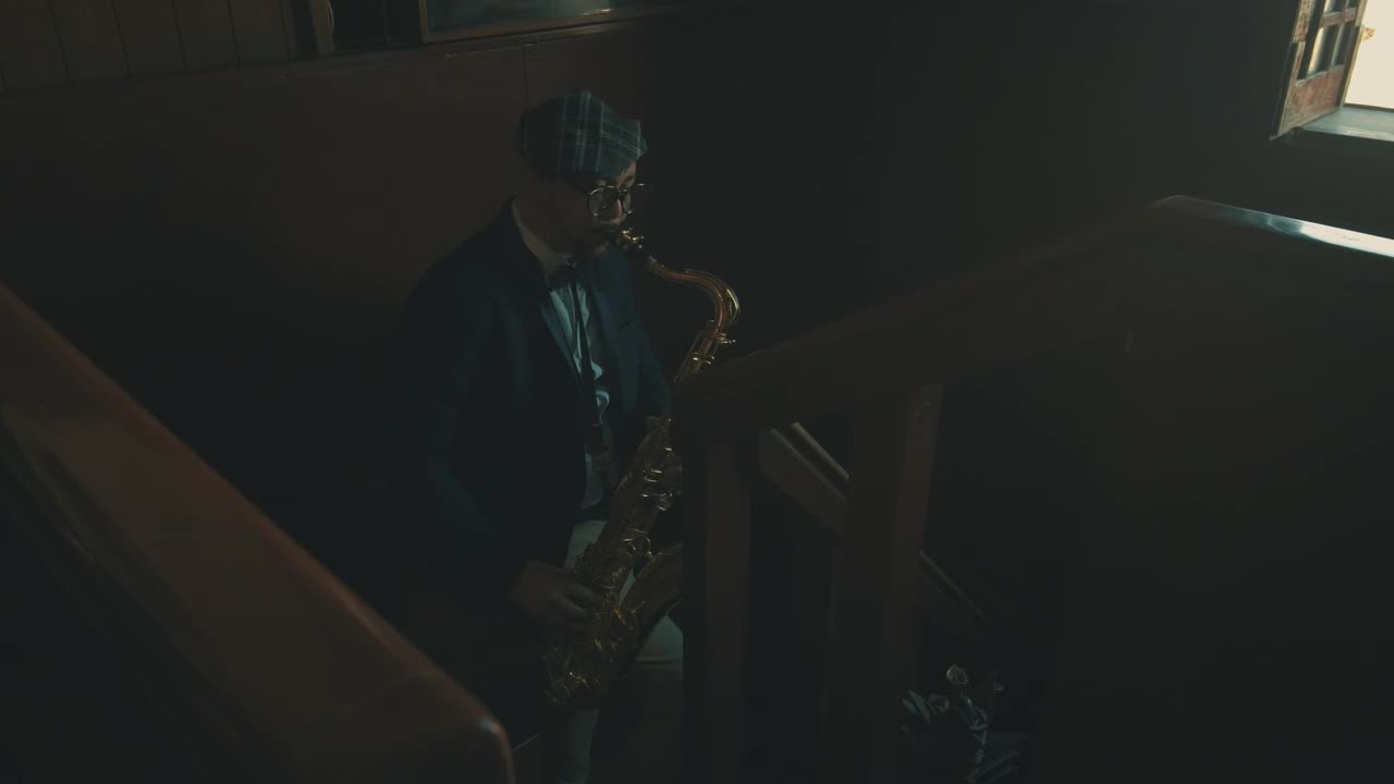 Stock Video Man Playing The Saxophone In The Stair Animated Wallpaper - Free Download
