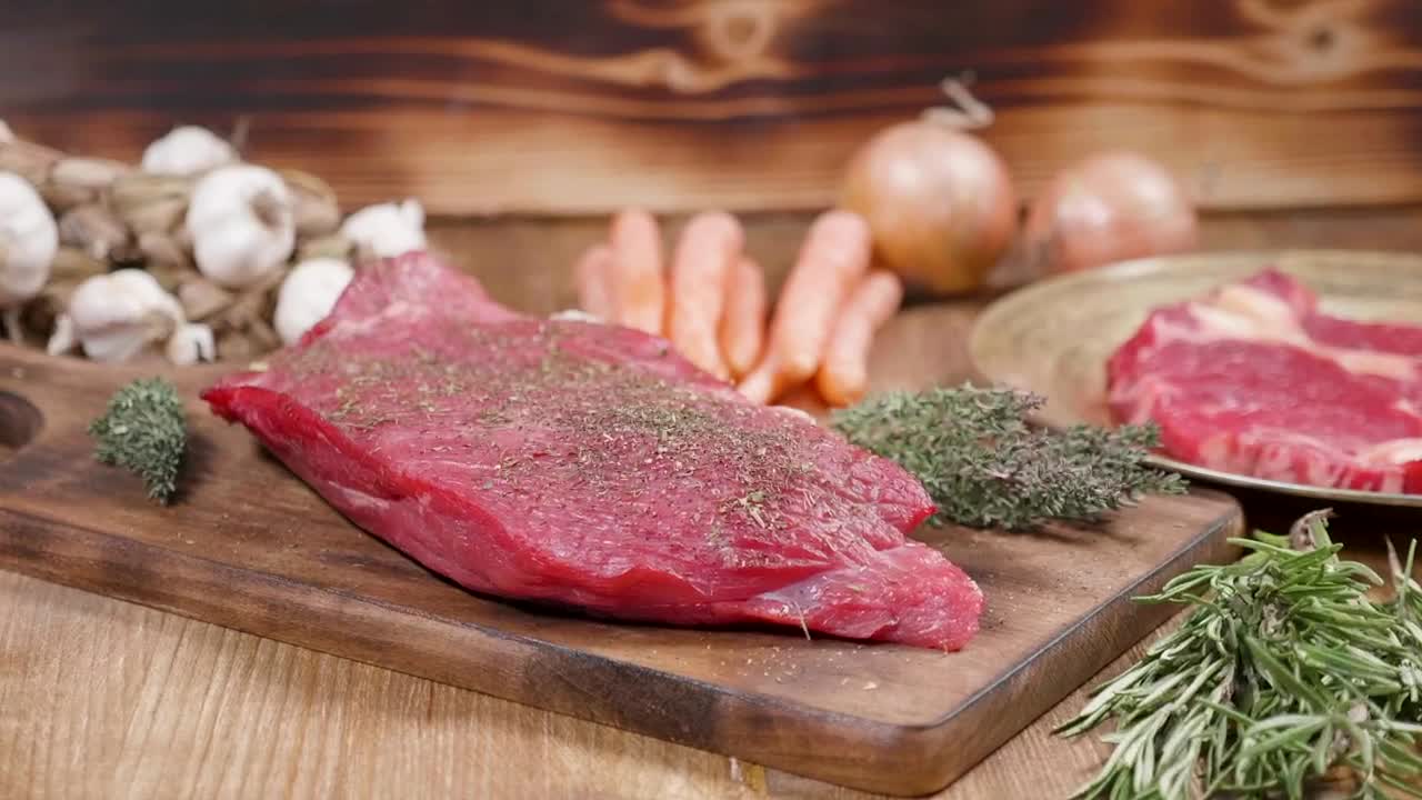Stock Video Keto Diet Seasoned Raw Steak On Wood Board Animated Wallpaper - Free Download