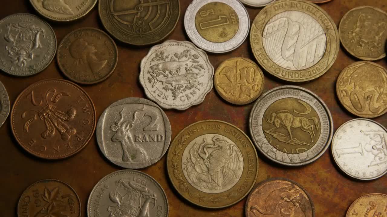 Stock Video Mix Of International Coins On The Tabl Animated Wallpaper - Free Download