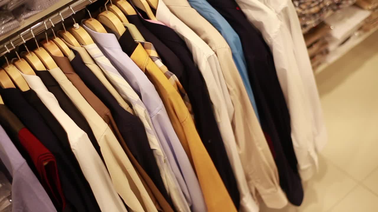Stock Video Man Looking For A Shirt In A Clothing Sho Animated Wallpaper - Free Download