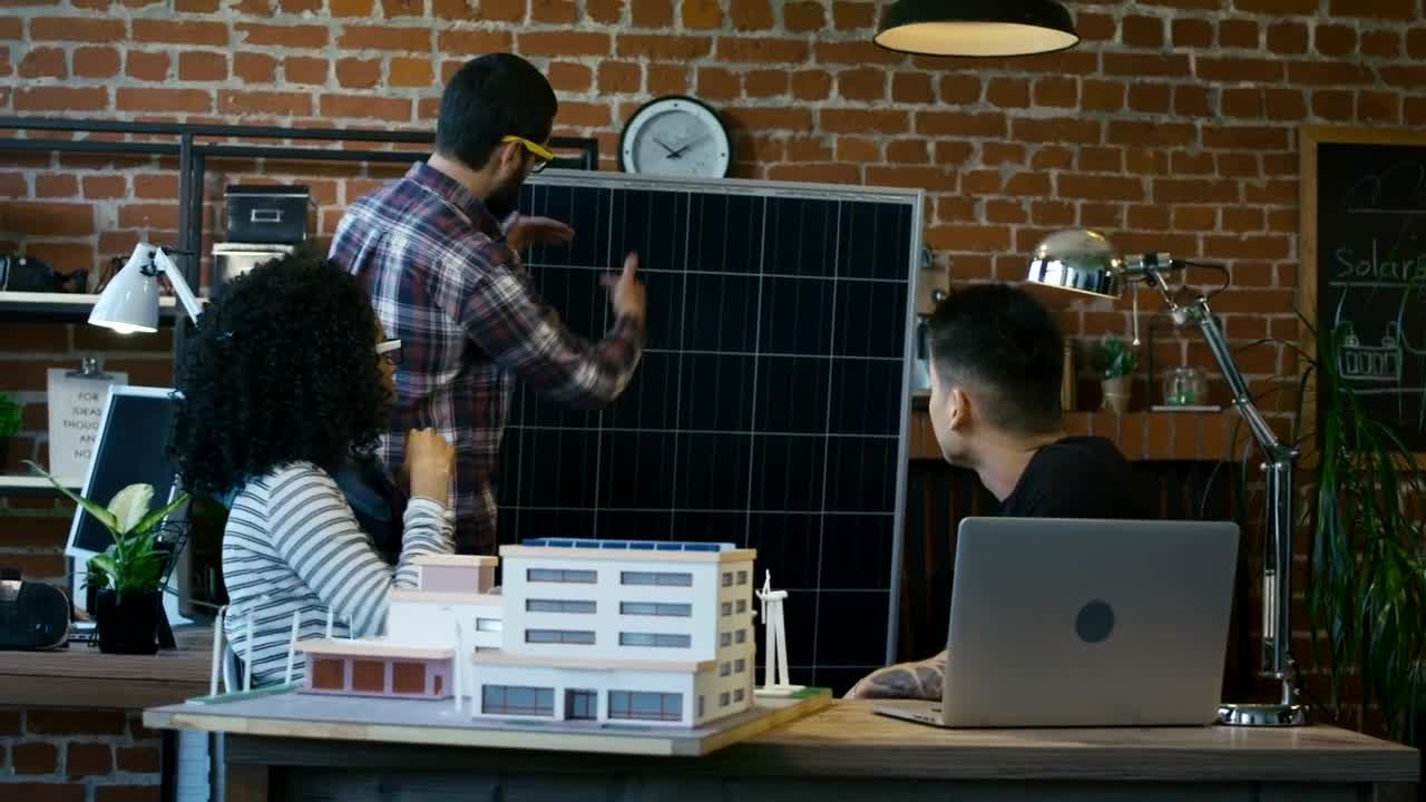 Free Video Stock team of architects reviewing a building model Live Wallpaper - Free Download