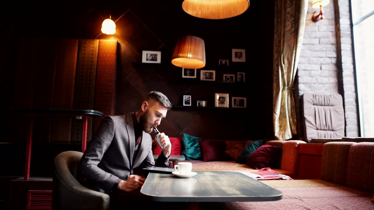Free Video Stock Stylish Urban Man Vaping Hookah In Cafe Live Wallpaper - Free Download