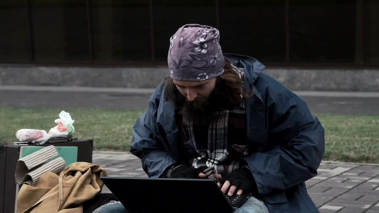 Stock Video Homeless Gets Good News On The Computer Animated Wallpaper - Free Download