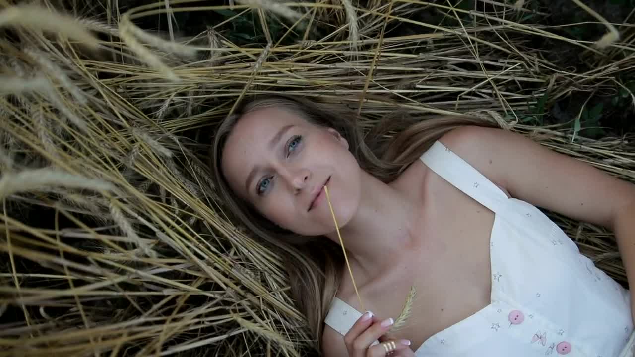 Stock Video Girl Lying On Straw In A Spinning Portrait Live Wallpaper For PC - Free Download