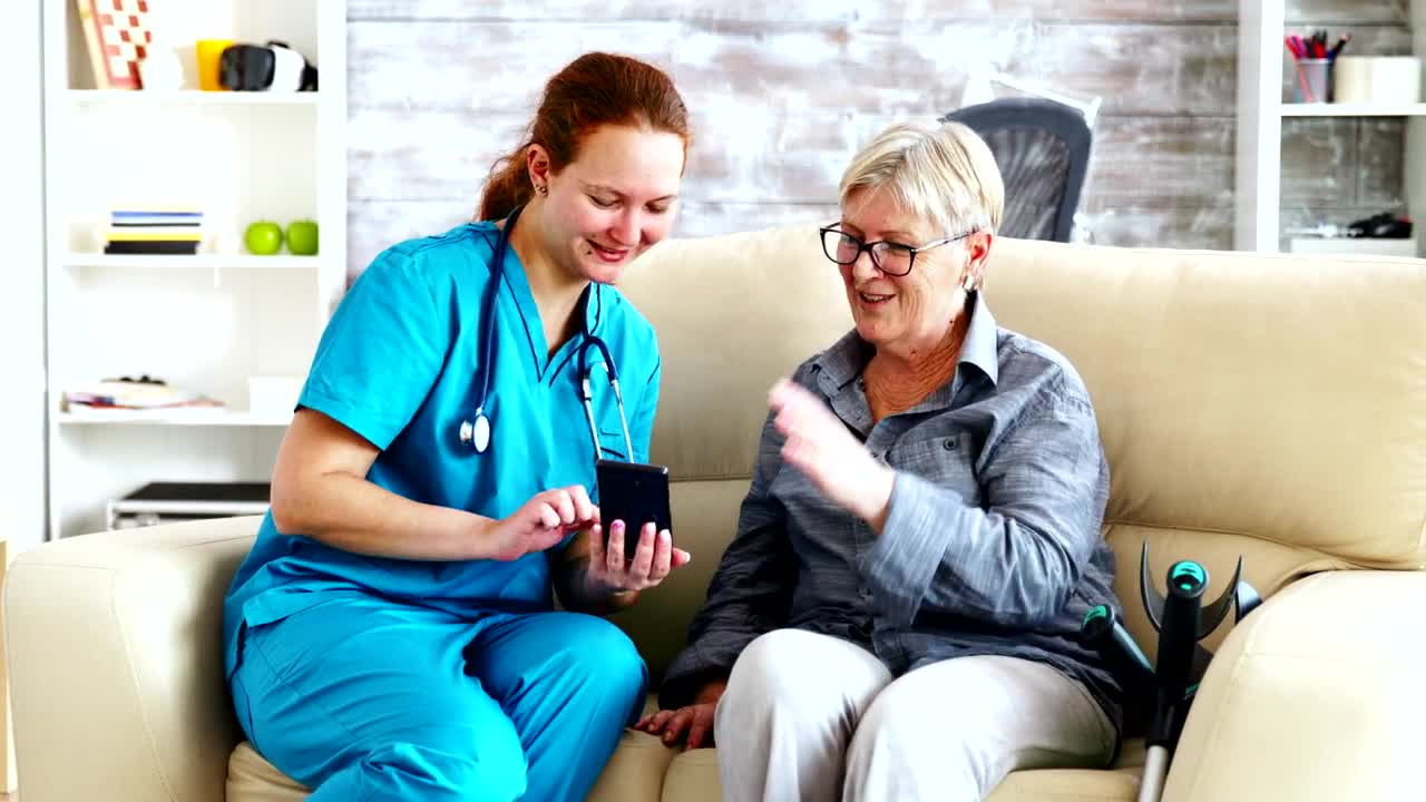 Stock Video Nurse Sitting With A Patient Live Wallpaper - Free Download