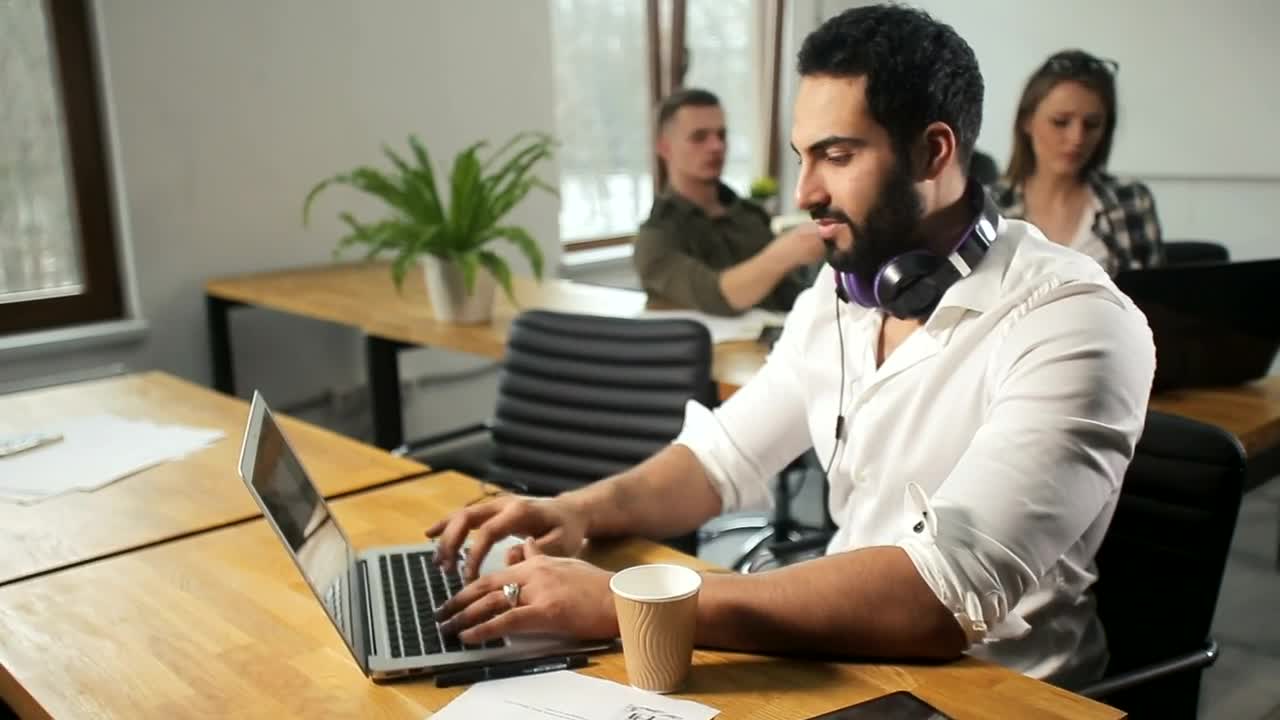 Free Video Stock team leader working happily on laptop Live Wallpaper - Free Download