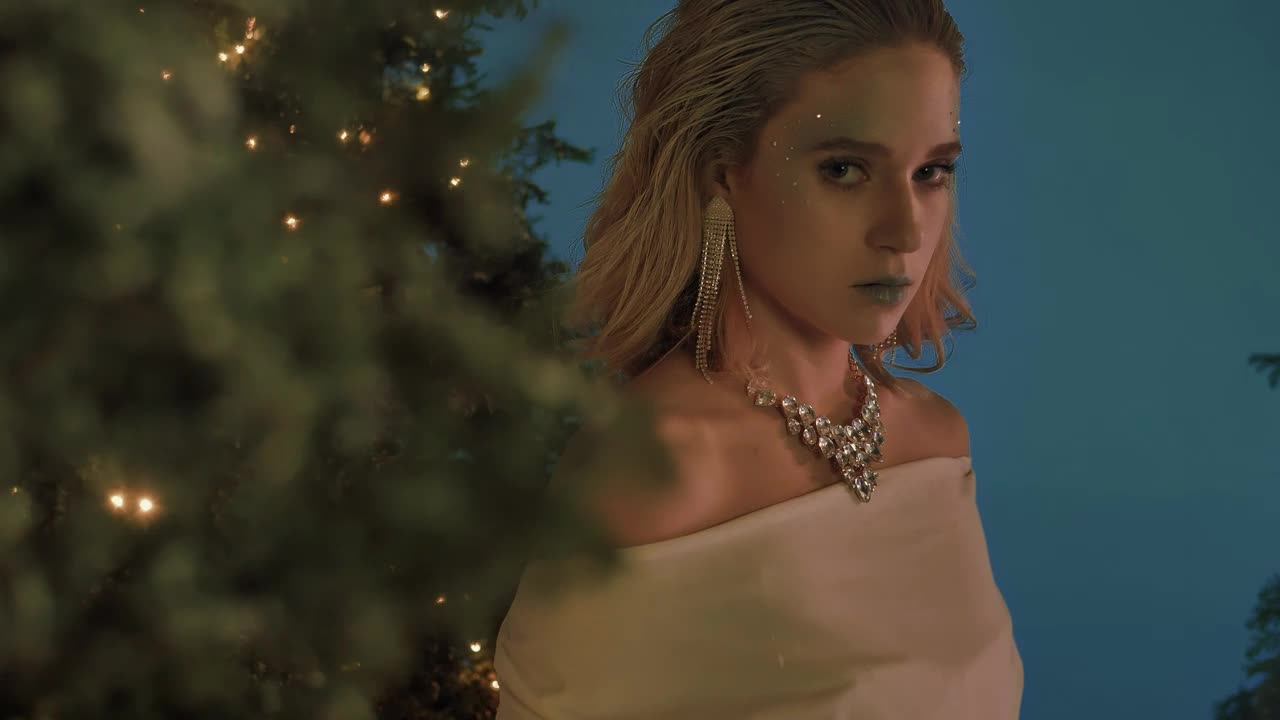 Stock Video Elegant And Captivating Girl Among Christmas Trees Live Wallpaper For PC - Free Download