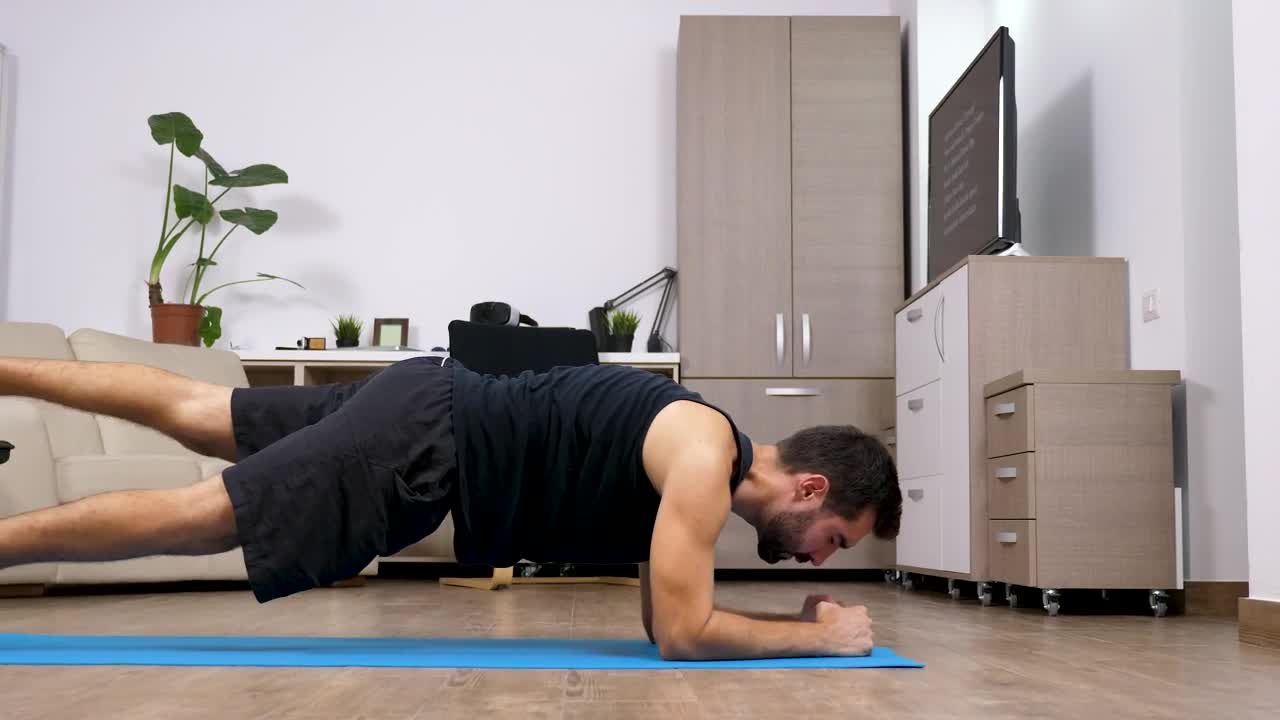 Stock Video Man Does Full Body Yoga Exercise In Living Room Animated Wallpaper - Free Download