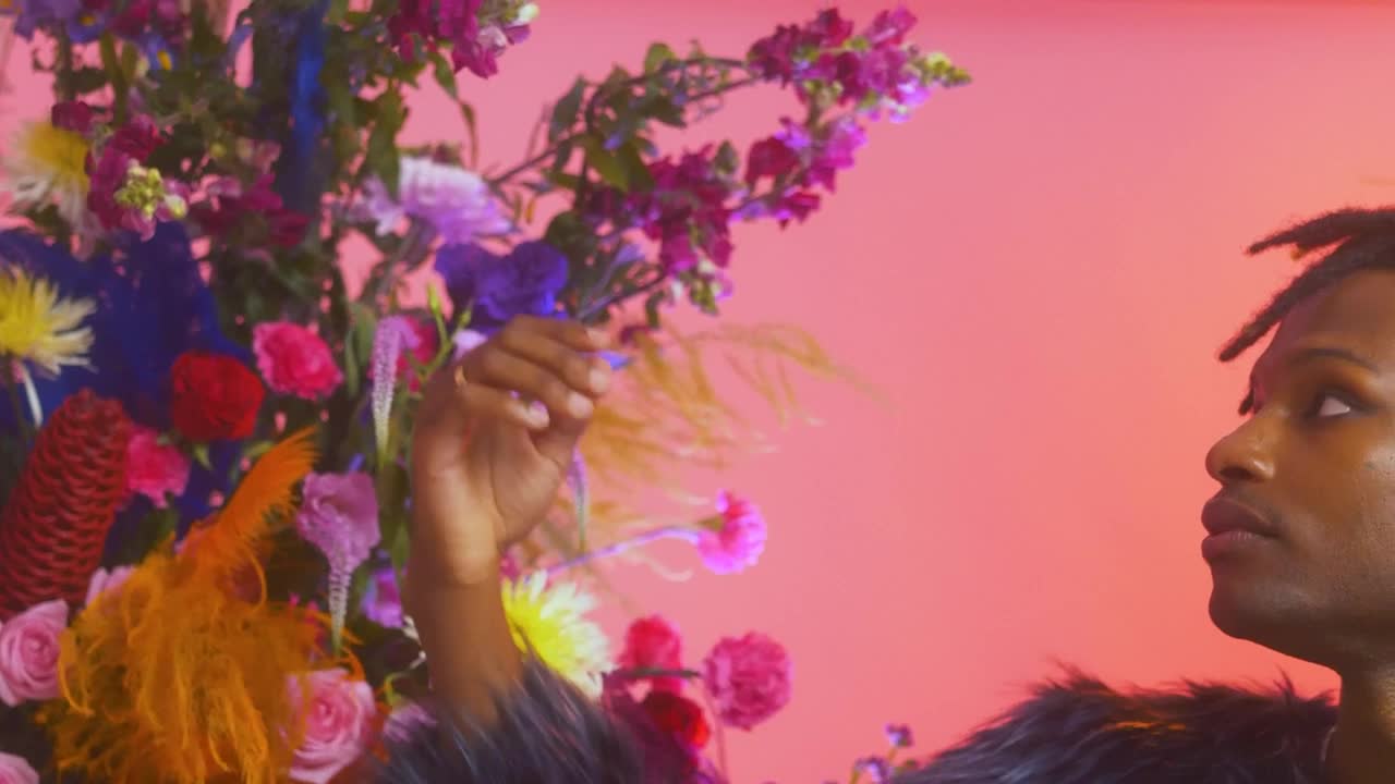Stock Video Man Stroking The Petals Of A Large Flower Arrangemen Animated Wallpaper - Free Download