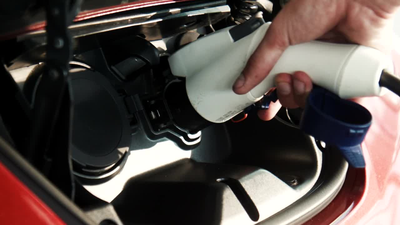Video Stock Charging An Electric Car Close Up Live Wallpaper For PC - Free Download