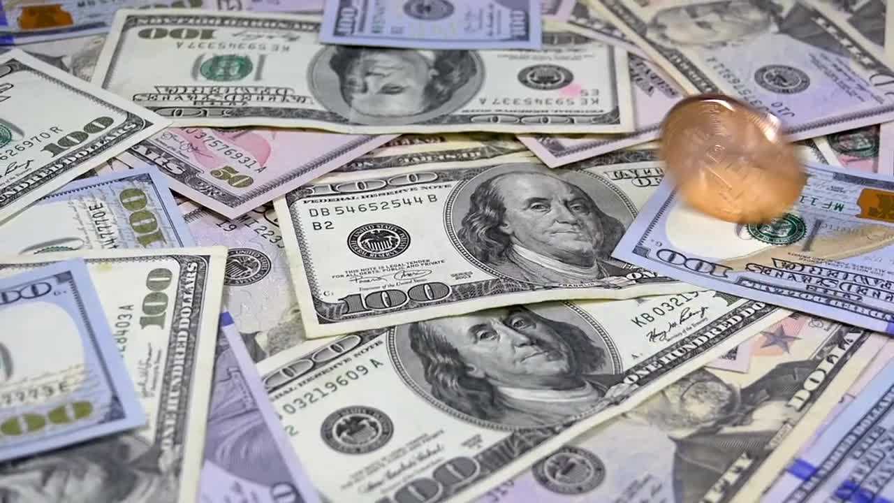 Stock Video Golden Bitcoin Rotating Over Dollar Bills Live Wallpaper For PC - Free Download