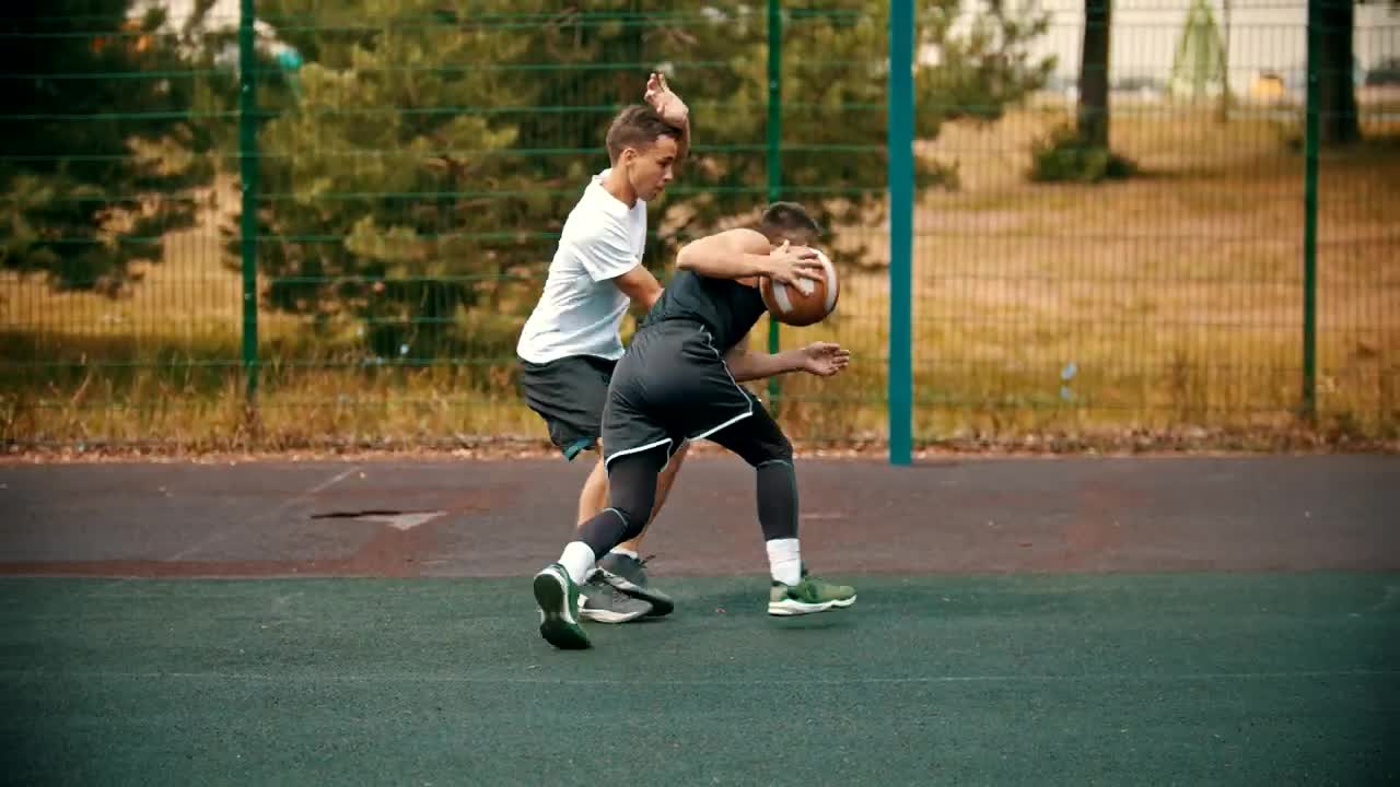 Stock Video Pair Of Young Men Playing Basketball In A Park Live Wallpaper - Free Download