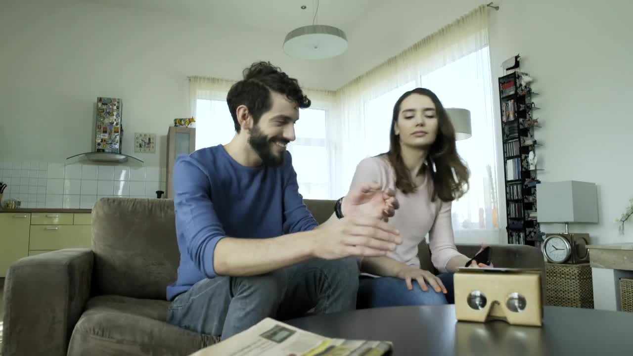 Stock Video Couple Assemble Cardboard Lenses For Virtual Reality Live Wallpaper For PC - Free Download