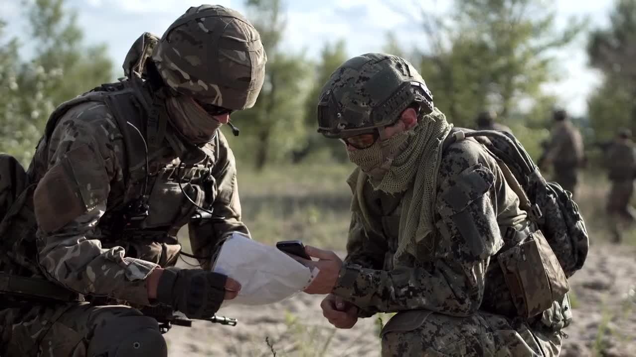 Stock Video Military Men Looking At Cell Phone And Ma Animated Wallpaper - Free Download