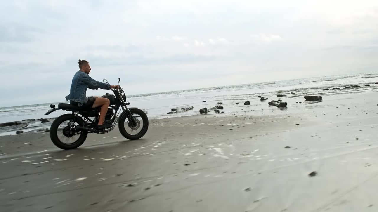 Free Video Stock tracking shot of a wanderlust riding a motorbike at the Live Wallpaper - Free Download