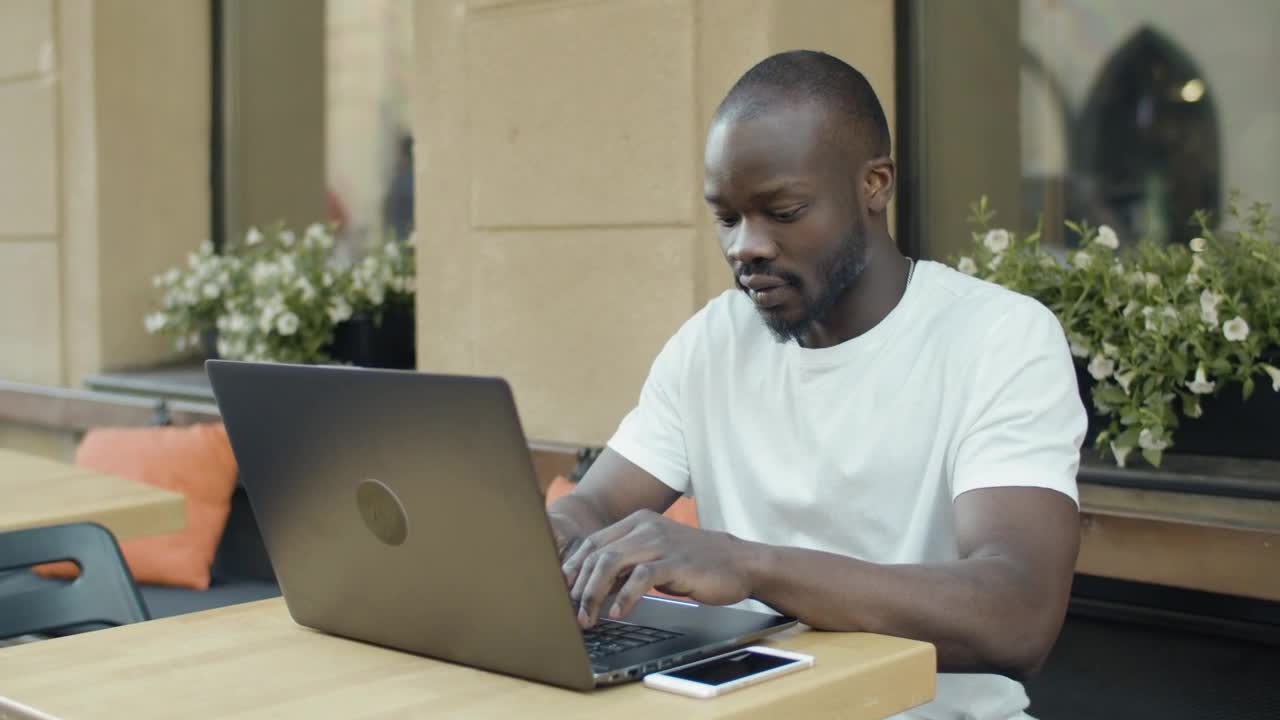 Stock Video Man Working Remotely From A Coffee Sho Animated Wallpaper - Free Download