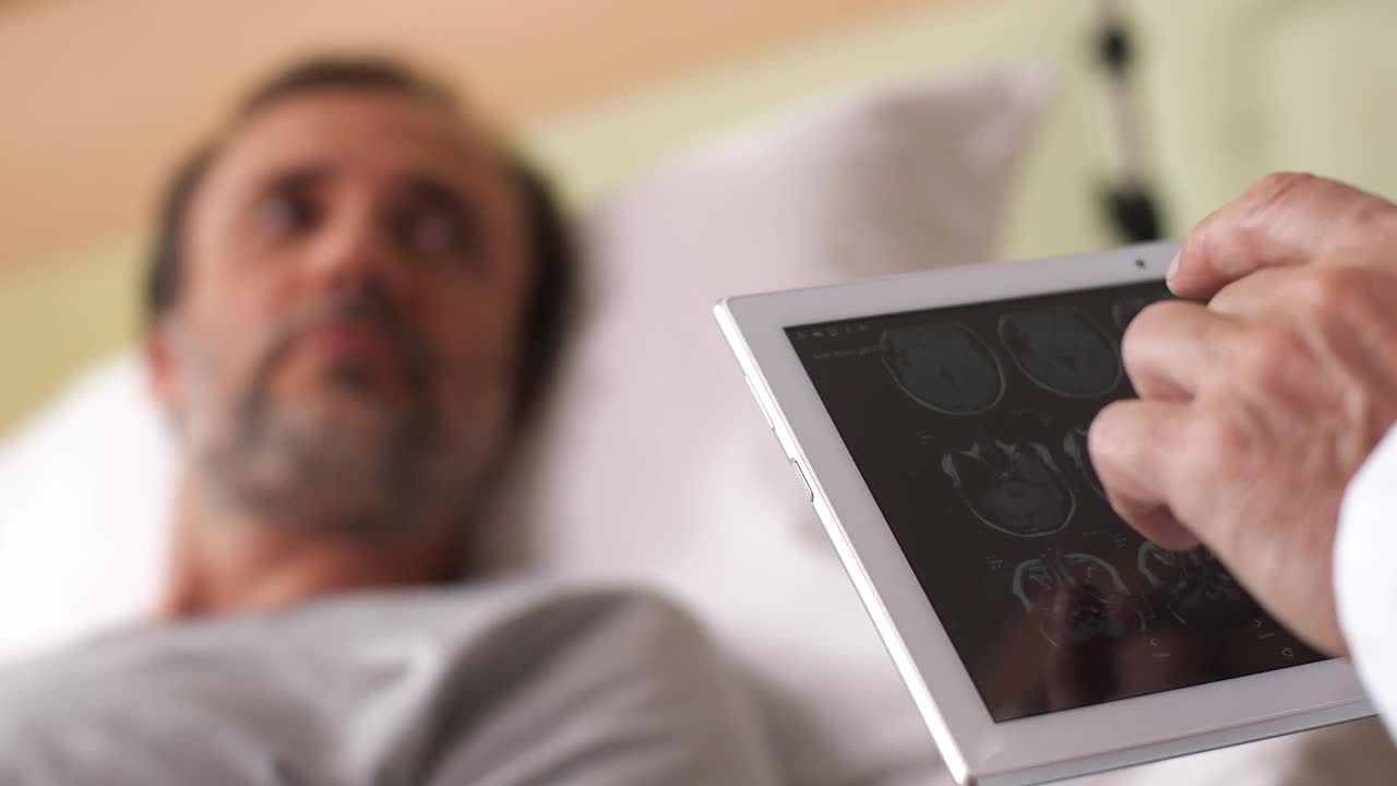 Stock Video Doctor Viewing Scan Results On A Tablet Live Wallpaper For PC - Free Download