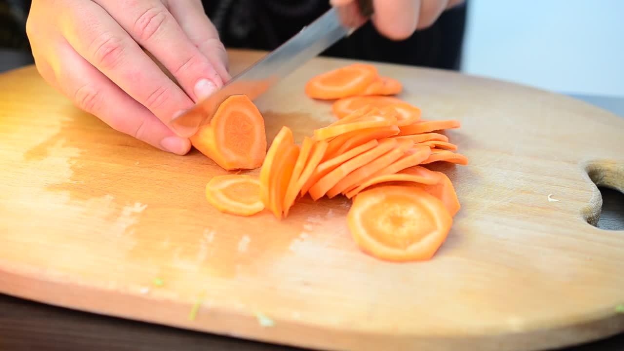 Stock Video Cutting Up Carrots On A Chopping Board Live Wallpaper For PC - Free Download