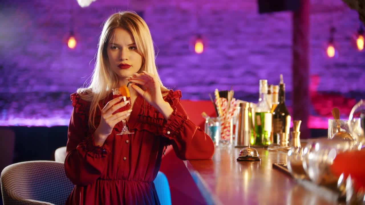 Stock Video Lonely Girl Sipping Her Drink In A Bar Animated Wallpaper - Free Download