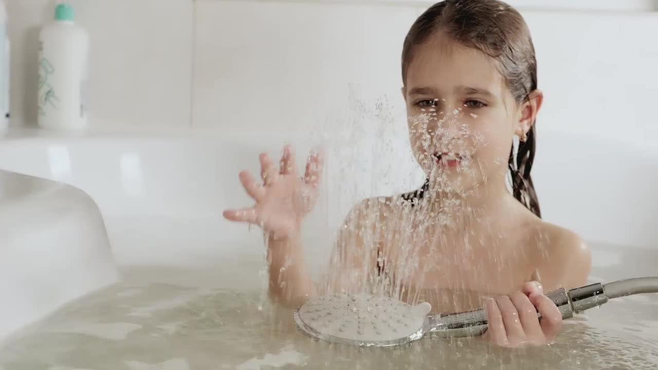 Stock Video Girl Playing With Water While Taking A Bath Live Wallpaper For PC - Free Download