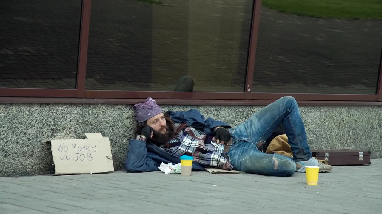Video Stock Businessman Giving Money To Homeless Man Live Wallpaper For PC - Free Download