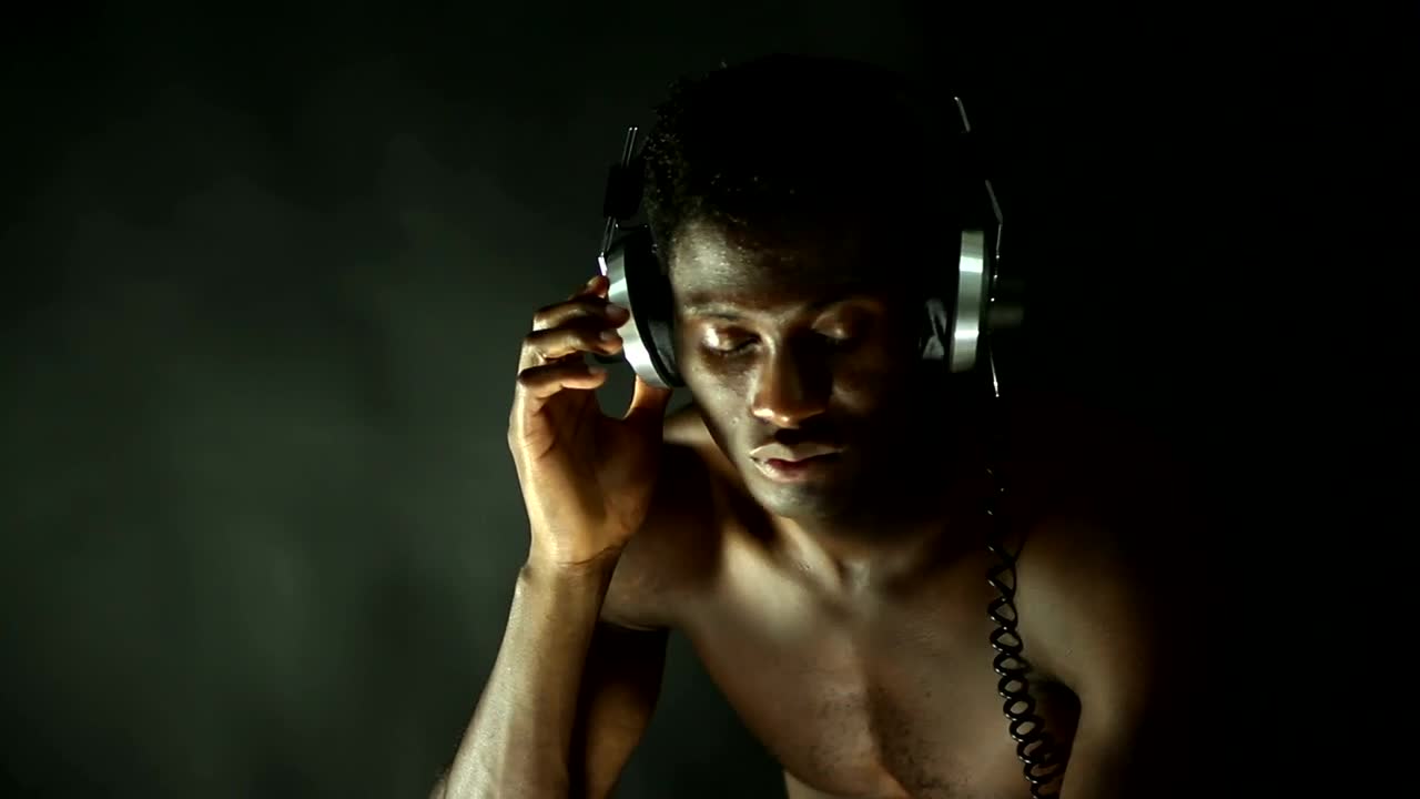 Free Stock Video Shirtless Man Listening To Music With Retro Headphones Live Wallpaper - Free Download