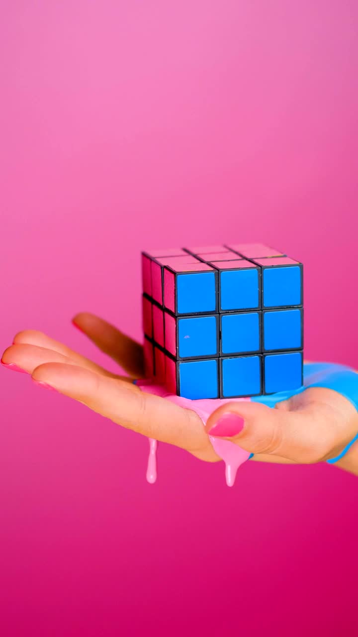Stock Video Hand Holding A Rubik Cube That Seems To Melt On Live Wallpaper For PC - Free Download