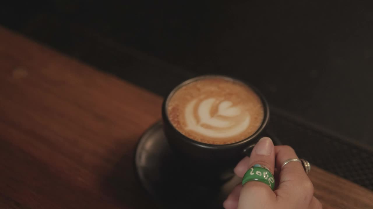 Free Stock Video Woman Drinking From A Cup Of Frothy Coffee Live Wallpaper - Free Download