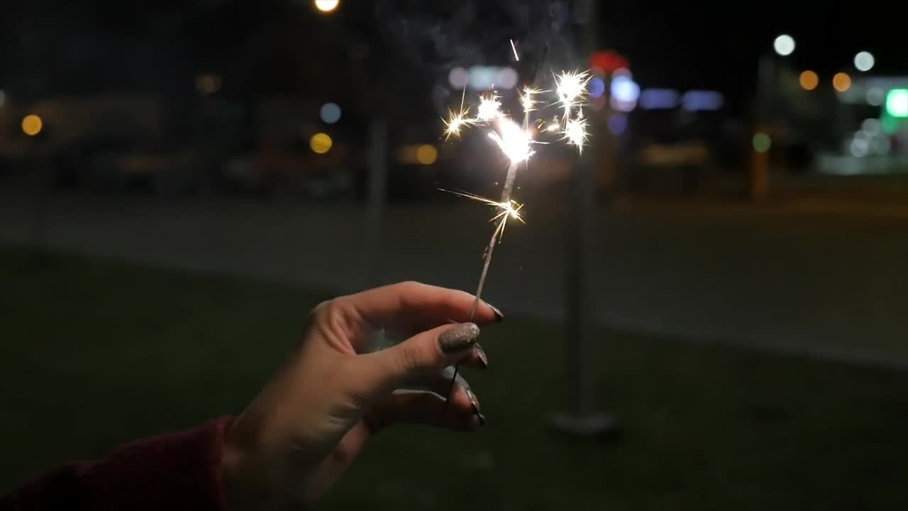 Stock Video Holding A Sparkler At Night Animated Wallpaper - Free Download