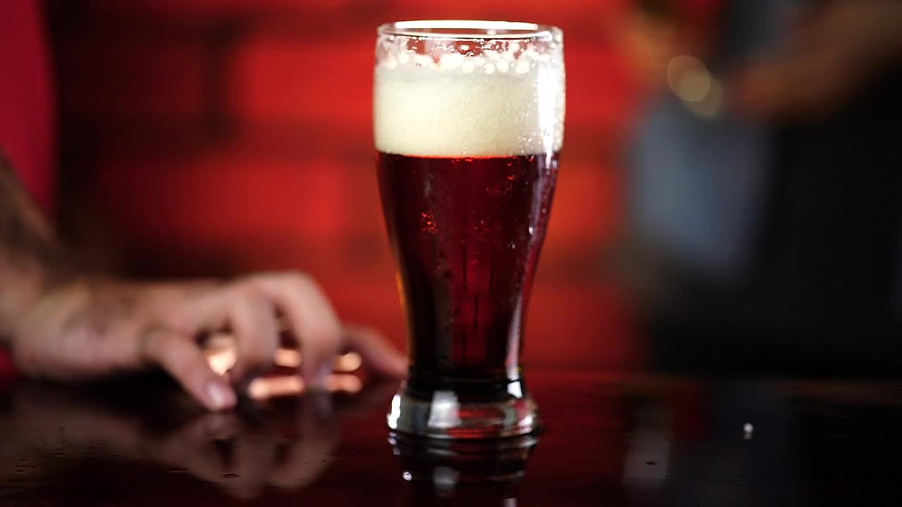 Stock Video Glass Of Beer In The Center Of A Table At Live Wallpaper For PC - Free Download