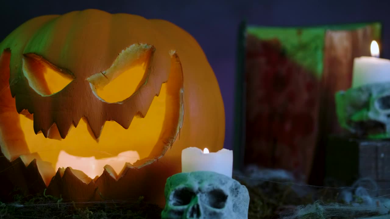 Stock Video Halloween Pumpkin With Cobwebs Candles Gravestones And Smoke Around Live Wallpaper For PC - Free Download