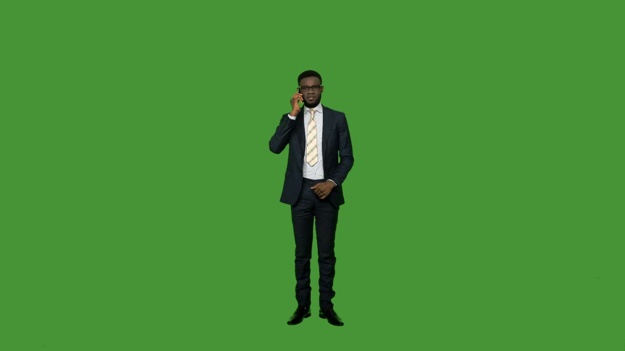 Stock Video Man In A Suit On The Phone On A Green Animated Wallpaper - Free Download