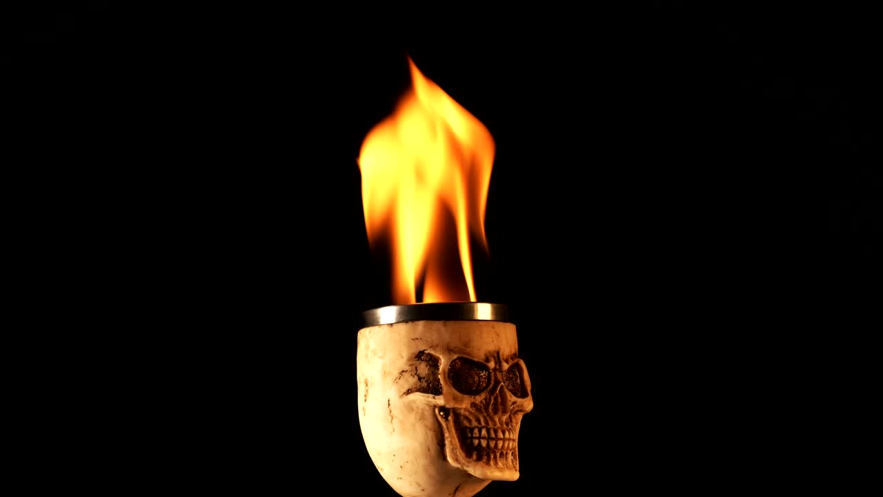 Free Video Stock Skull Shaped Cup With Fire On Black Background Live Wallpaper - Free Download