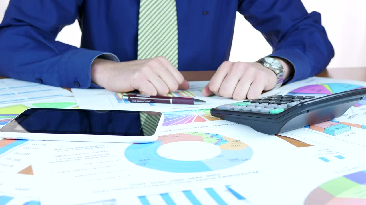 Stock Video Man Analyzing The Charts Animated Wallpaper - Free Download