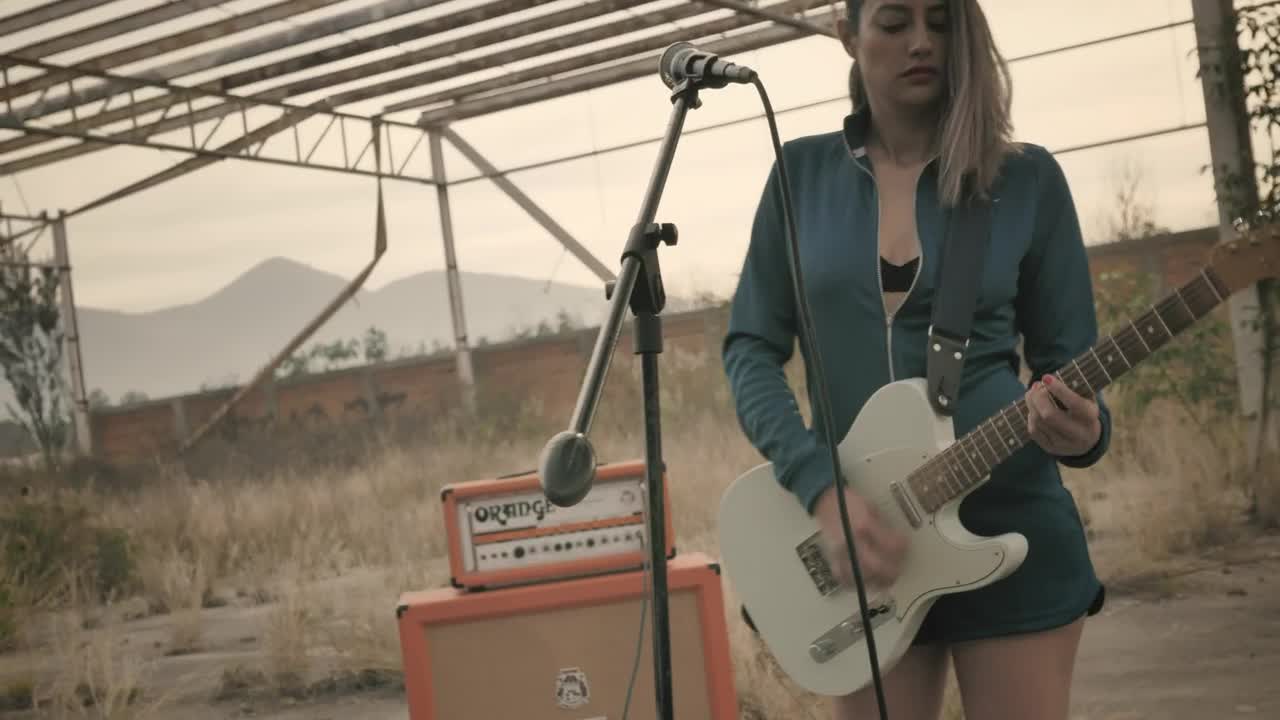 Stock Video Girl Playing Guitar In A Wasteland Live Wallpaper For PC - Free Download